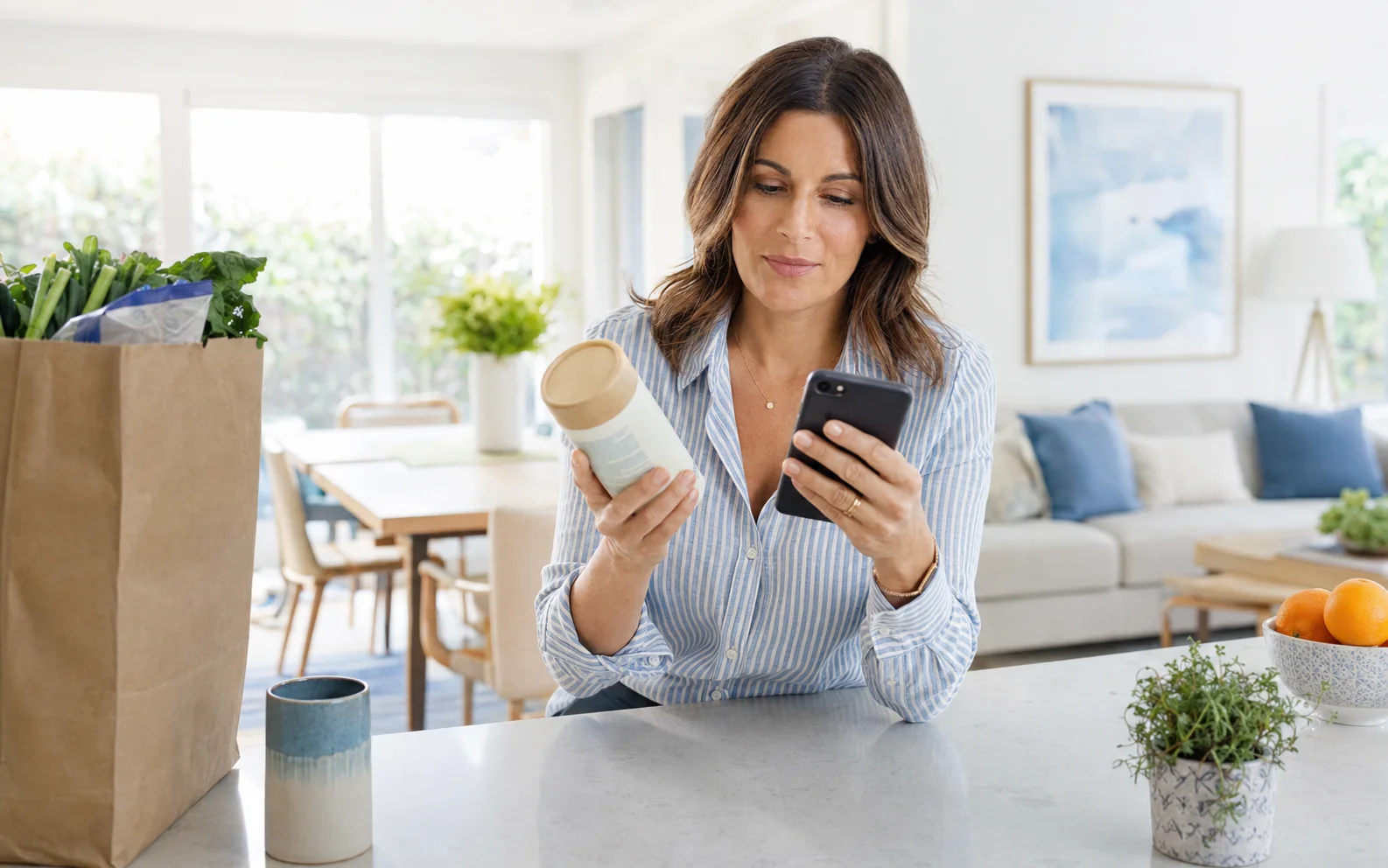 A consumer at home reviewing a product she purchased